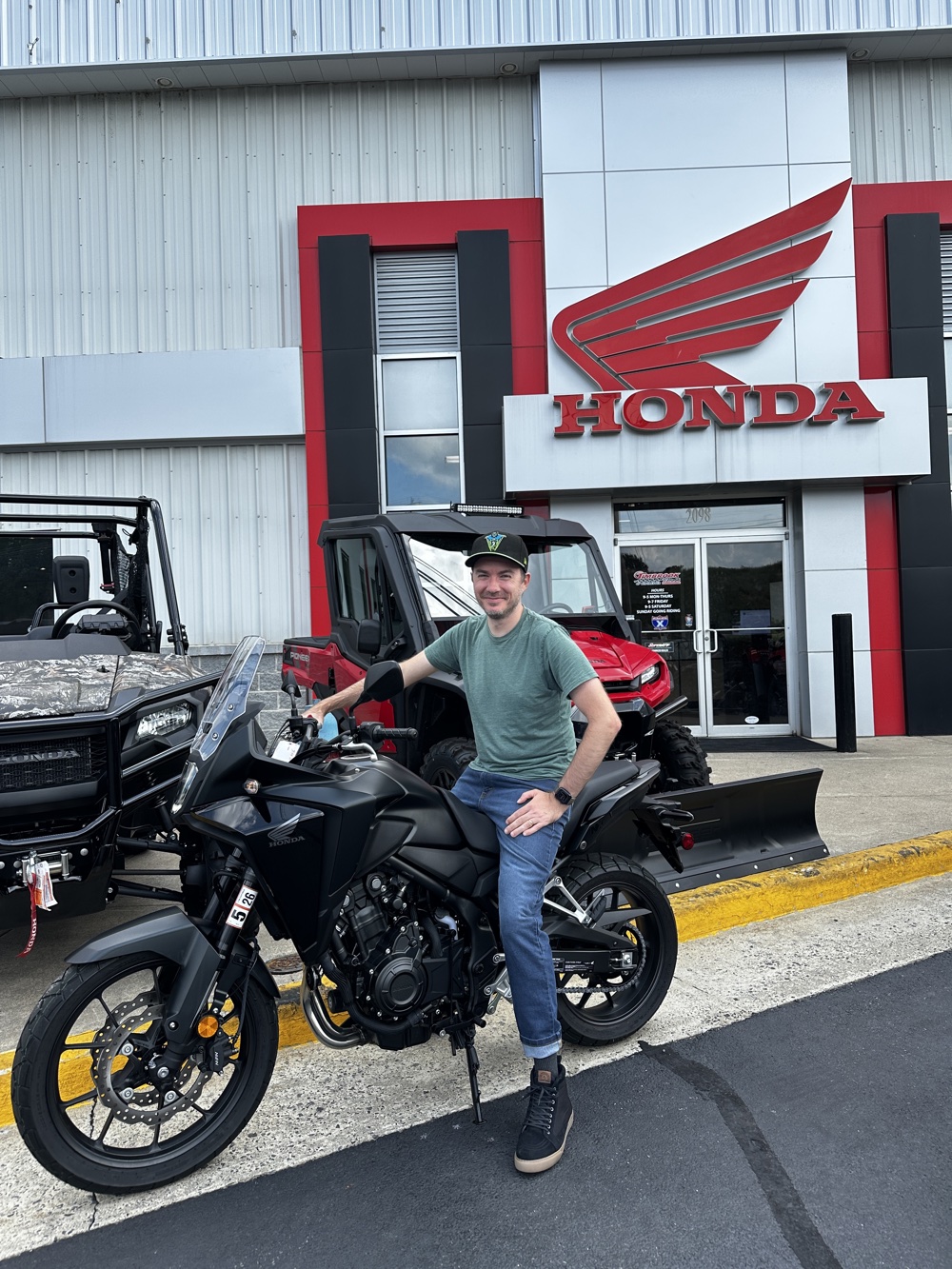 A photo of me at the Honda dealership sitting on my new
NX500
